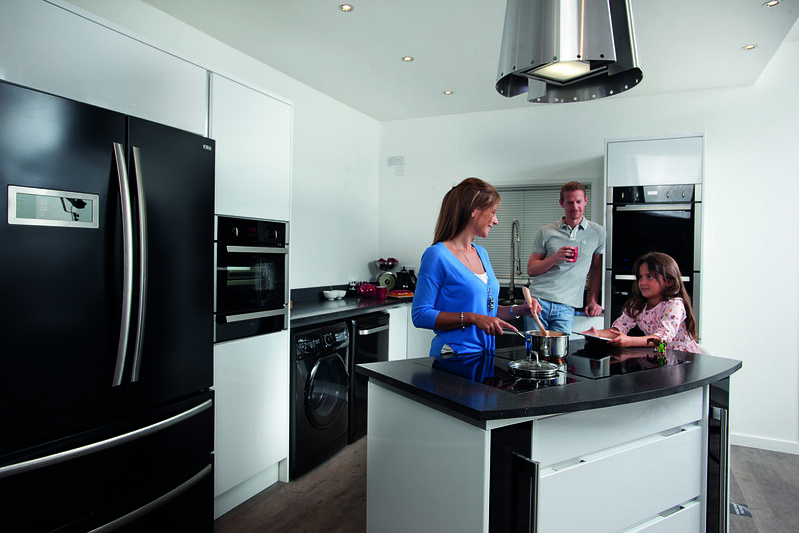 Family cooking together in a kitchen